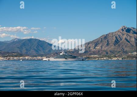 Puerto Banús, with luxury cars parked in port, Yachts behind