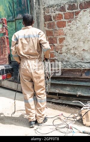 Back welder working in the workshop Stock Photo