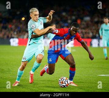 LONDON, United Kingdom, SEPTEMBER 27: L-R Brighton & Hove Albion's Leandro Trossard holds of Crystal Palace's Marc Cucurella during Premier League bet Stock Photo