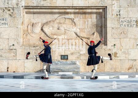 Evzones (soldiers of the greek Presidential Guard) in front of the monument of the Uknown Soldier's tomb in front of the greek Parliament Stock Photo