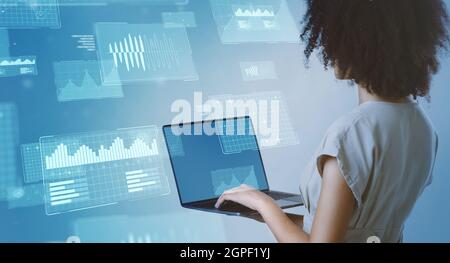 African american woman data analyst typing on laptop Stock Photo