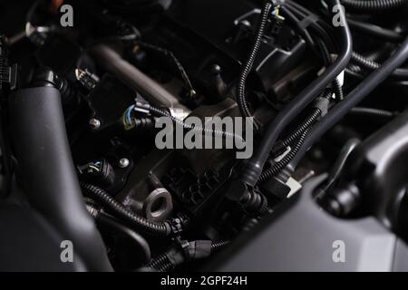 Closeup of electronics and engine under hood of car Stock Photo