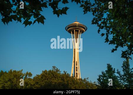 Seattle, WA, US - July 5, 2021: View of the iconic Seattle Space Needle isolated at golden hour against bright blue sky. Stock Photo