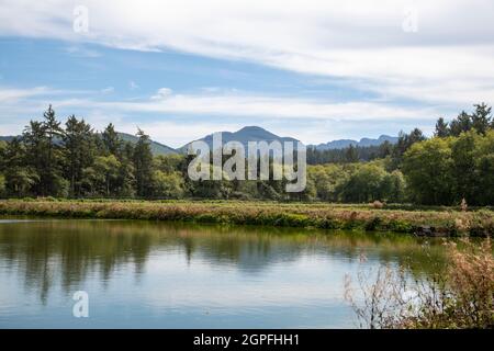 Mountain Landscape with Water in Foreground near Seaside Oregon Stock Photo