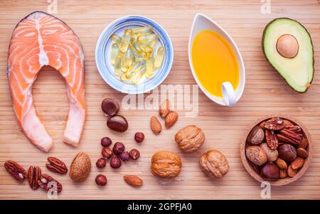 Selection food sources of omega 3 and unsaturated fats. Superfood high vitamin e for healthy food. Almond ,pecan ,hazelnuts,walnuts ,olive oil ,fish o Stock Photo
