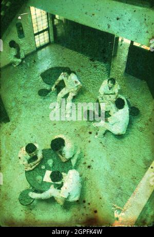 Austin Texas USA, September, 1987: Inmates gather in a common area of the Travis County Jail. ©Bob Daemmrich Stock Photo