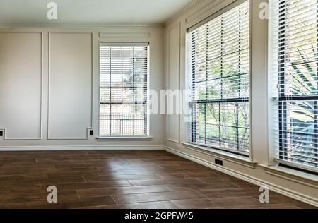 Empty living room with hardwood floor and emtpy white walls Stock Photo
