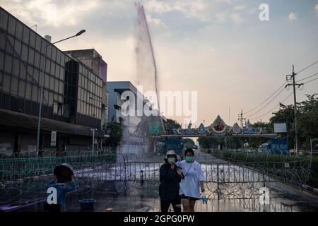 Bangkok, Thailand. 29th Sep, 2021. Riot police fire a water cannon towards protestors during a pro-democracy rally in Bangkok, Thailand, Wednesday, September 29, 2021. The protest remained peaceful until met with police resistance that saw the use of a potent mix of chemicals from water cannons similar to the effects of tear gas or pepper spray, while protestors through plastic bags filled with paint and some small, homemade explosives. (Credit Image: © Andre Malerba/ZUMA Press Wire) Stock Photo