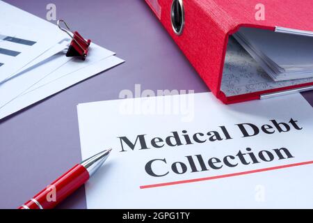 Medical debt collection papers and red folder. Stock Photo