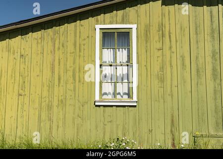 Old green window on barn Stock Photo
