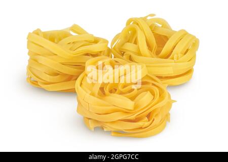Raw tagliatelle pasta isolated on white background with clipping path and full depth of field Stock Photo