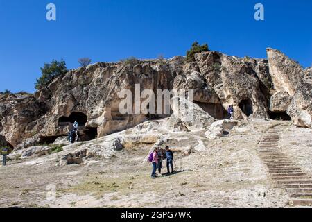 Afyonkarahisar, Turkey - September 26, 2021: People are visiting ancient caves in the Phrygian Valley. Phrygian Valley is a historical place in Turkey Stock Photo