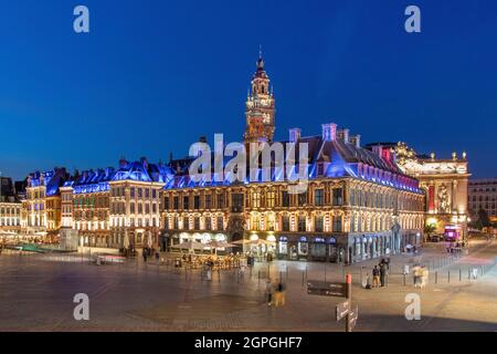 France, Nord, Lille, Place du General De Gaulle or Grand Place, old stock market and belfry of the Chamber of Commerce and Industry in the background Stock Photo