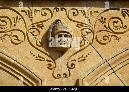 France, Doubs, Le Russey, square, city hall dated 19th century, old covered market and justice of the peace, facade, head of a judge Stock Photo