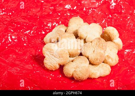 Tasty Butter Cookies; Photo On Crackled Red Background Stock Photo