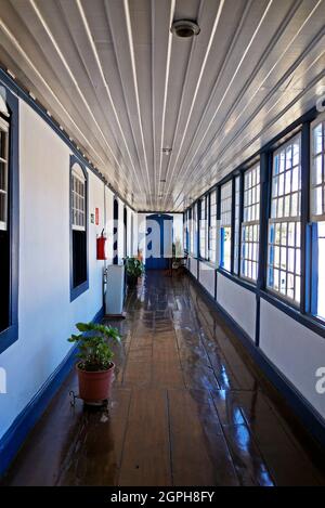 DIAMANTINA, MINAS GERAIS, BRAZIL - JANUARY 22, 2019: Corridor with colonial windows at Gloria's House (Casa da Gloria) Stock Photo