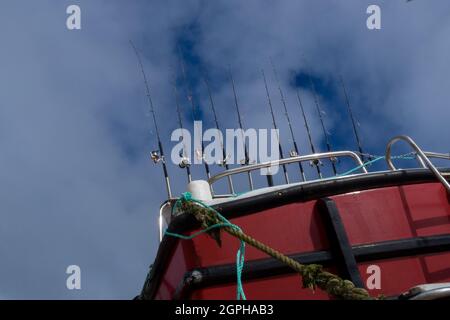 A Line Of Ten Hand Fishing Rods On A Cornish Boat In St. Ives Harbour Harbor - UK Stock Photo