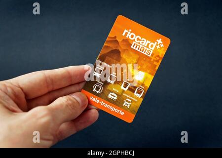RIO DE JANEIRO, BRAZIL - OCTOBER 31, 2020: Hand holding a Riocard, which can be used to pay for any kind of public transport on Rio de Janeiro city