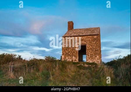 Puncknowle, Dorset, UK.  29th September 2021. The Grade II listed Lookout on the Knoll at Puncknowle in Dorset shortly before sunset.  Picture Credit: Graham Hunt/Alamy Live News Stock Photo