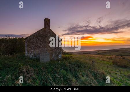 Puncknowle, Dorset, UK.  29th September 2021. The sunset viewed from the Grade II listed Lookout on the Knoll at Puncknowle in Dorset which has commanding views of the Jurassic Coast.  Picture Credit: Graham Hunt/Alamy Live News Stock Photo