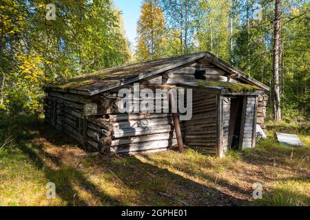 Abandoned and dilapidated log cabin in Finnish Lapland Stock Photo