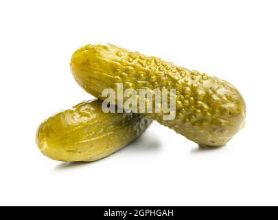 Marinated pickles. Canned cucumbers isolated on white background. Stock Photo