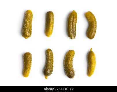 Marinated pickles. Canned cucumbers isolated on white background. Stock Photo
