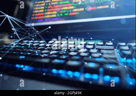 Computer of a programmer with lines code of software Stock Photo