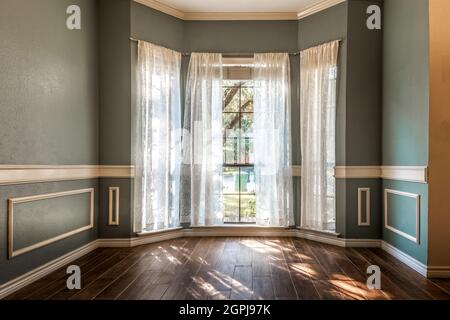 Empty living room with hardwood floors Stock Photo