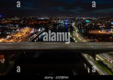 Glasgow, Scotland, UK. 29th Sep, 2021. PICTURED: Aerial drone view of the Kingston Bridge at night which spans the River Clyde. It's Europes business bridge transporting some 120,000 vehicles daily on the M8 Motorway. In just over a month COP26 Climate Change Conference will have landed on Glasgow, and Glasgow Kingston Bridge, along with numerous other routes in the city will be under either shut down for the duration or restricted to traffic. Credit: Colin Fisher/Alamy Live News Stock Photo