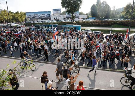 Ljubljana, Slovenia. 29th Sep, 2021. Protesters march on the streets of Ljubljana during the demonstration.Thousands of people protested against the government, covid measures, wearing of face masks, vaccines and RVT green pass (Recovered-Vaccinated-Tested) condition in Ljubljana, Slovenia. Credit: SOPA Images Limited/Alamy Live News Stock Photo