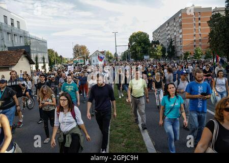 Ljubljana, Slovenia. 29th Sep, 2021. Protesters march on the streets of Ljubljana during the demonstration.Thousands of people protested against the government, covid measures, wearing of face masks, vaccines and RVT green pass (Recovered-Vaccinated-Tested) condition in Ljubljana, Slovenia. Credit: SOPA Images Limited/Alamy Live News Stock Photo