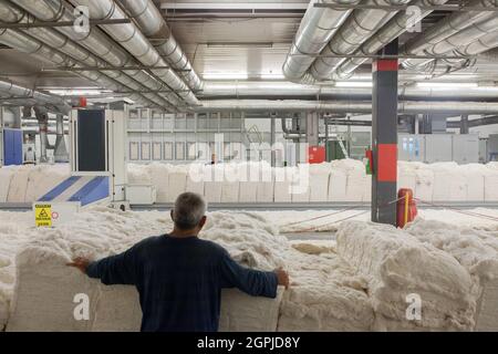 Denizli / Turkey - 06/07/2014: Unknown worker working in textile factory. Stock Photo