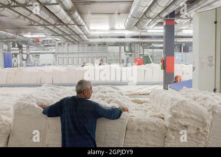 Denizli / Turkey - 06/07/2014: Unknown worker working in textile factory. Stock Photo