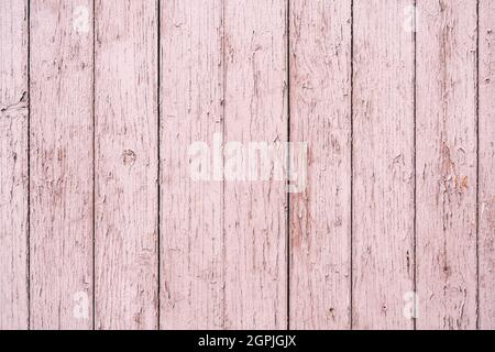 Old wooden wall with paint peeling off as background and texture. Stock Photo
