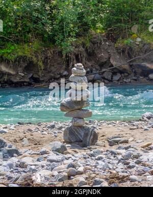 Sunny scenery including a pebble tower at a river around the Stubaital in Tyrol, Austria Stock Photo