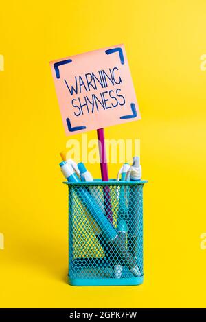 Hand writing sign Warning Shyness. Business overview Lack of confidence Not able to speak out or express oneself Colorful Idea Presentation Displaying Stock Photo