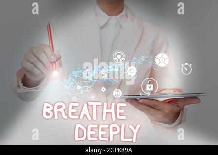 Sign displaying Breathe Deeply. Business showcase to take a large breath of air into your lungs To pause Lady In Suit Holding Phone And Performing Stock Photo