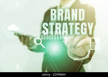 Text caption presenting Brand Strategy. Business approach Longterm plan for the development of a successful brand Woman In Uniform Carrying Phone And Stock Photo