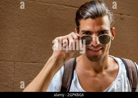 Portrait of young latin man with sun glasses Stock Photo