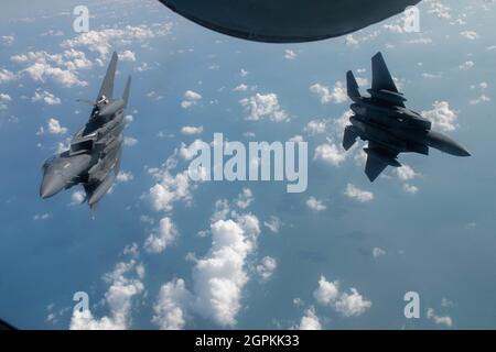 A pair of U.S. Air Force F-15E Strike Eagles assigned to the 494th Expeditionary Fighter Squadron, fly in formation over the Mediterranean Sea during Bright Star 21, Sept. 16, 2021. The 93rd EARS supported aerial refueling during Bright Star to both ensure participation from U.S. Air Force F-15E Strike Eagle aircraft assigned to the 332nd Air Expeditionary Wing and provide training qualification opportunities for 12 Egyptian air force F-16 Fighting Falcon pilots. Bright Star 21 provides the opportunity to test a collective ability to work with partners to address realistic scenarios across air Stock Photo