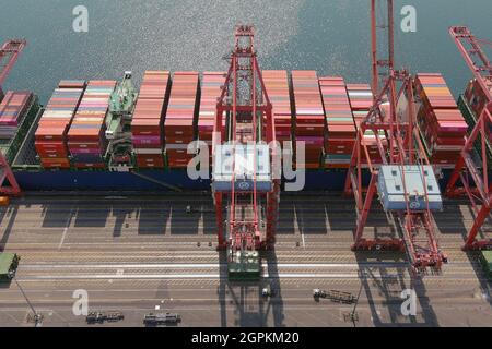 Cargo container vessels ships are backlogged at the Port of Long Beach, Wednesday, Sept. 29, 2021, in Long Beach, Calif.  = Stock Photo