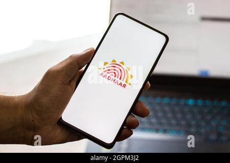 West Bangal, India - September 28, 2021 : Aadhaar logo on phone screen stock image. Stock Photo