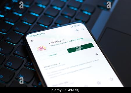 West Bangal, India - September 28, 2021 : Aadhaar logo on phone screen stock image. Stock Photo