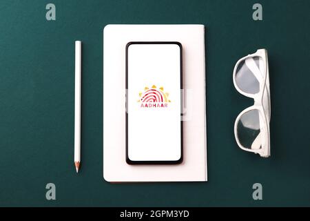 West Bangal, India - September 28, 2021 : Aadhaar logo on phone screen stock image. Stock Photo