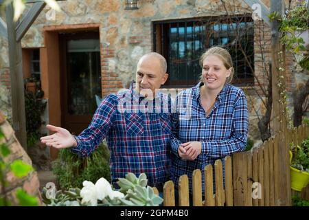Man and woman standing outdoors Stock Photo