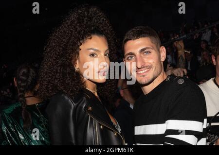 Marco Verratti and his wife Jessica Aidi attend the Balmain Festival as