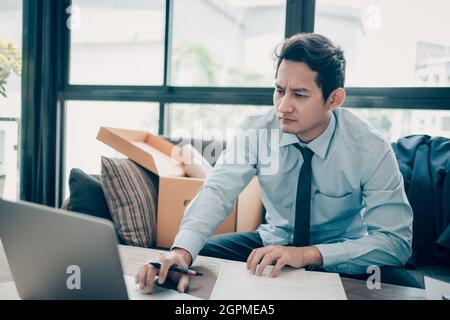 Young businessman working on laptop. Stock Photo