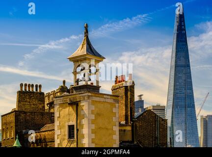 Bell Tower of St Peter’s Chapel at the Tower of London, with the Shard in the background. Stock Photo