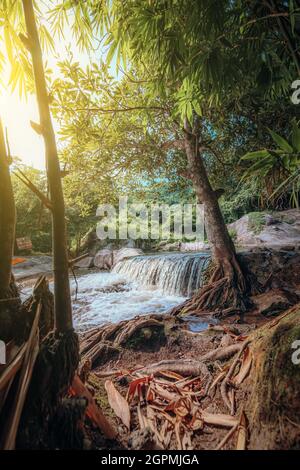Beautiful waterfall and light of sun in the jungle. Nature background concept. Stock Photo